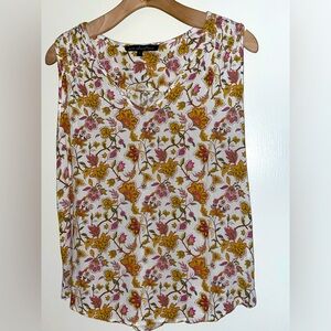 Sleeveless, light as air, flowered top by ava Christine.